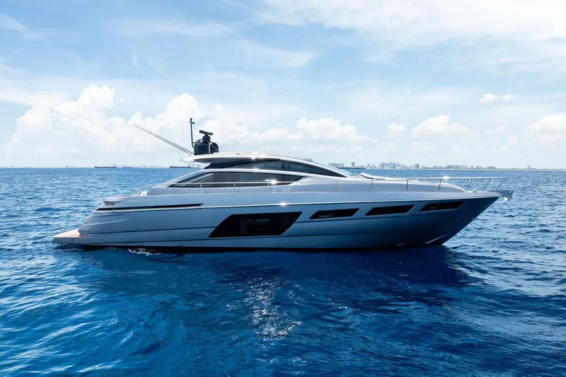  Yacht Photos Pics 2024 Pershing 6X yacht cruising on open blue sea under clear sky.