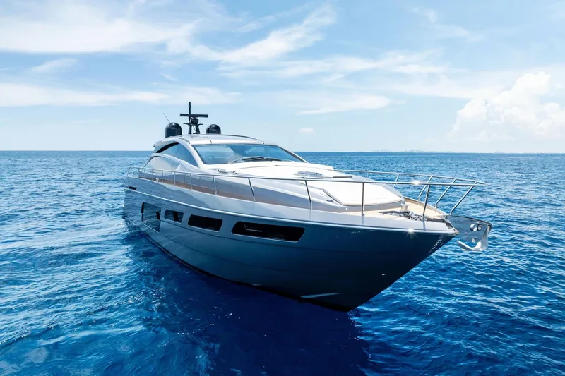  Yacht Photos Pics 2024 Pershing 6X yacht cruising on open blue sea under clear sky.