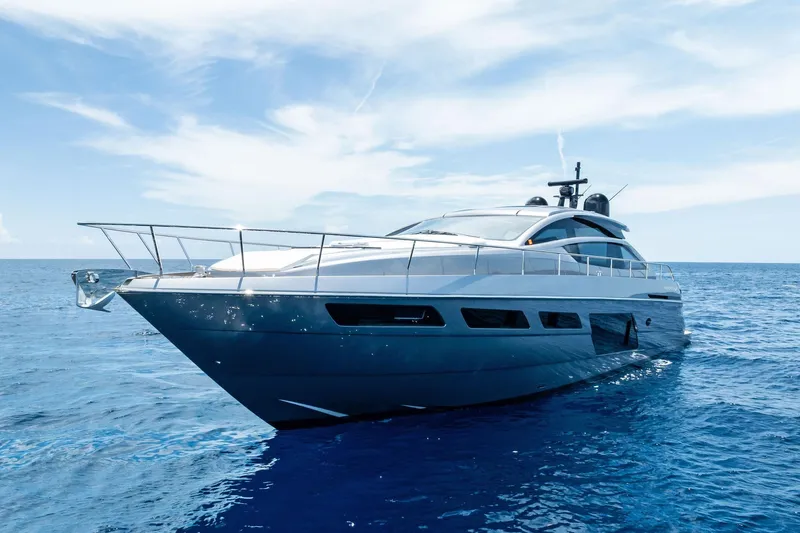  Yacht Photos Pics 2024 Pershing 6X yacht cruising on open sea under clear blue sky.