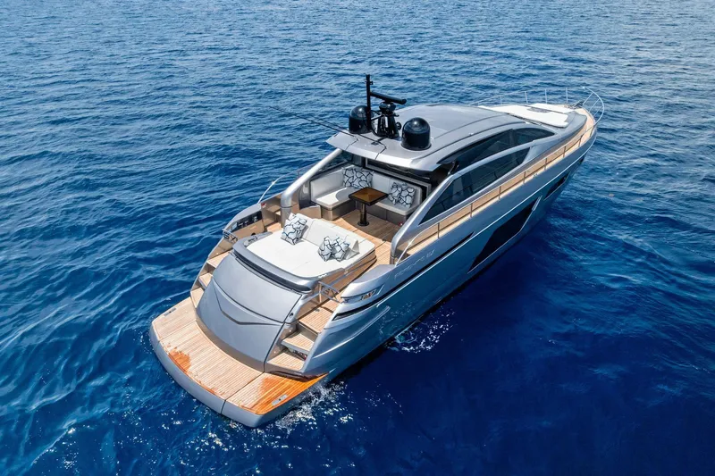  Yacht Photos Pics 2024 Pershing 6X luxury yacht cruising on open blue sea.