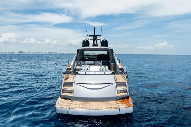  Yacht Photos Pics 2024 Pershing 6X yacht on open sea, showcasing sleek design and luxury features.