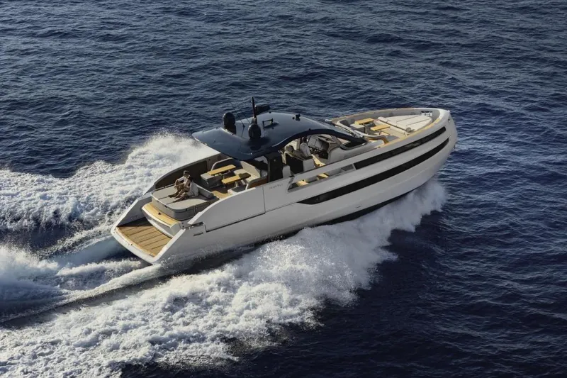  Yacht Photos Pics 2025 Invictus TT550 yacht cruising on open sea, showcasing sleek design and luxury features.