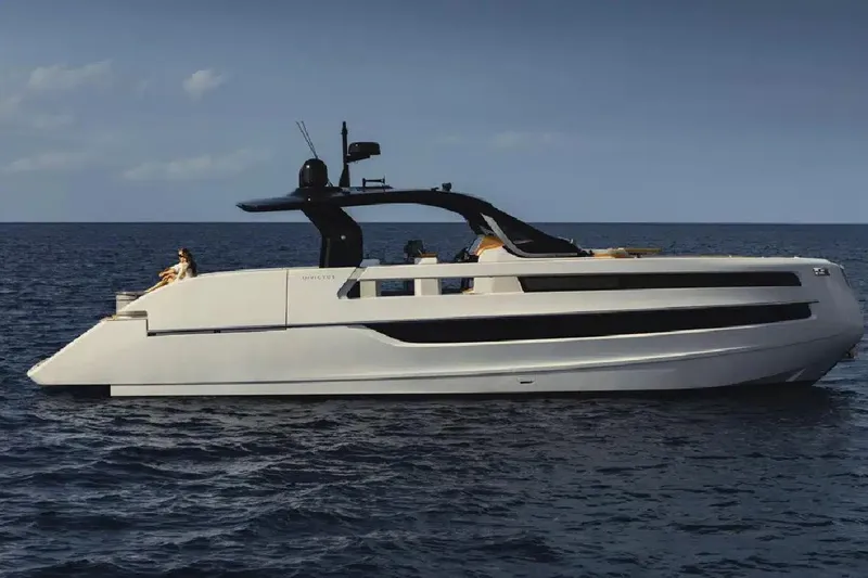  Yacht Photos Pics 2025 Invictus TT550 yacht cruising on open sea under clear sky.