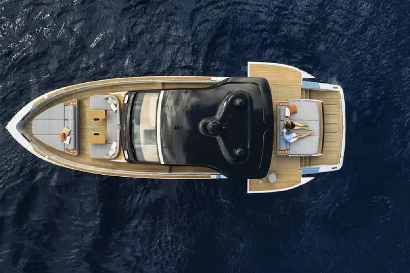  Yacht Photos Pics Aerial view of 2025 Invictus TT550 yacht on open water, featuring luxurious deck seating.