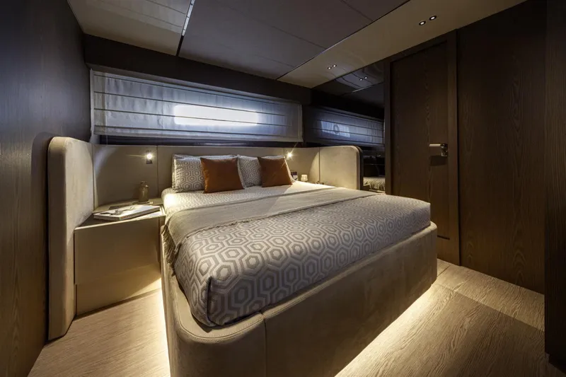  Yacht Photos Pics Luxurious bedroom interior of 2025 Invictus TT550 yacht with modern design and ambient lighting.