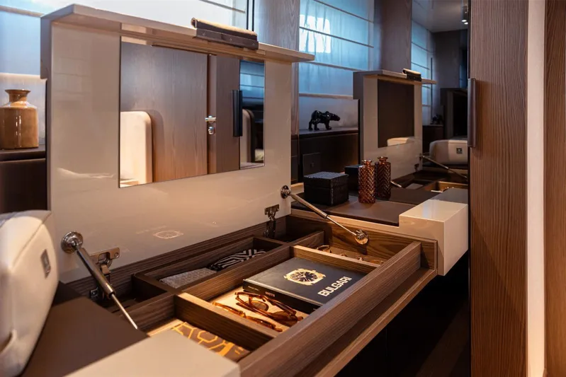  Yacht Photos Pics Luxurious interior of 2025 Invictus TT550 yacht with elegant wooden cabinetry and modern decor.