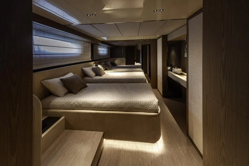  Yacht Photos Pics Luxurious interior of 2025 Invictus TT550 yacht with elegant bedding and ambient lighting.