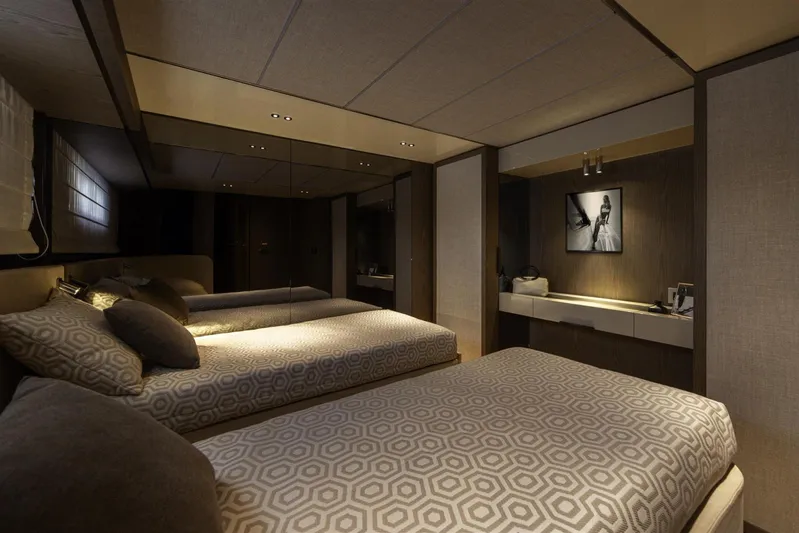  Yacht Photos Pics Luxurious bedroom interior of 2025 Invictus TT550 yacht with modern decor and ambient lighting.