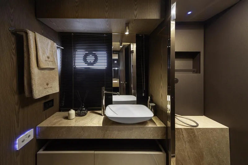  Yacht Photos Pics Luxurious bathroom interior of 2025 Invictus TT550 yacht with modern fixtures and elegant design.