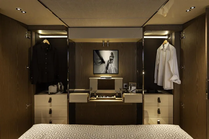  Yacht Photos Pics Luxurious Invictus TT550 2025 yacht interior with elegant wardrobe and modern decor.