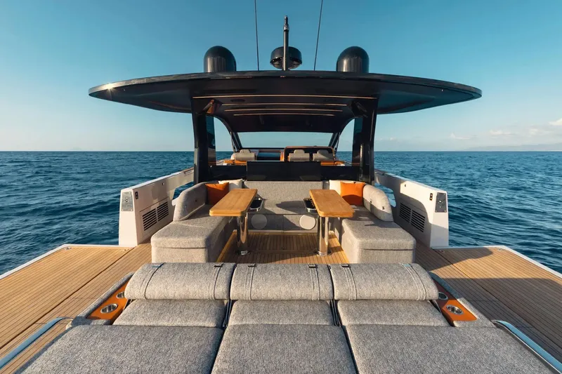  Yacht Photos Pics Luxurious 2025 Invictus TT550 yacht with elegant deck seating on open sea.
