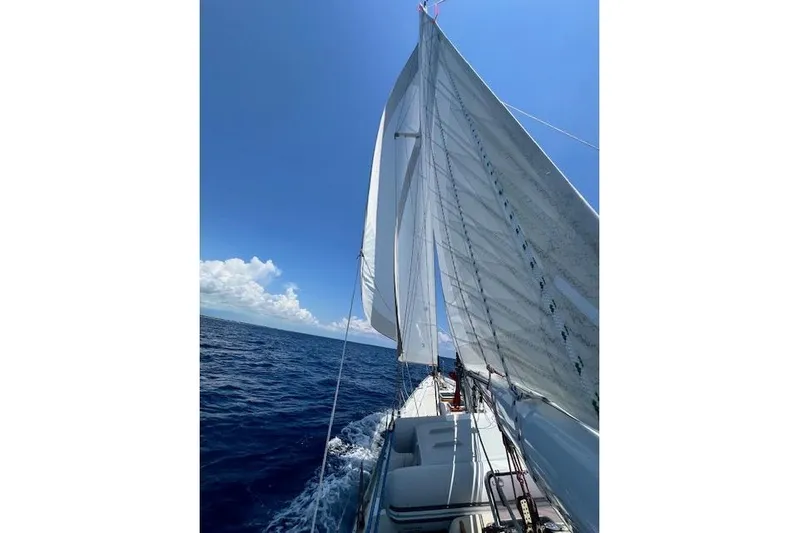  Yacht Photos Pics Sailing on a 1985 Robert Clark Ketch under clear blue skies.