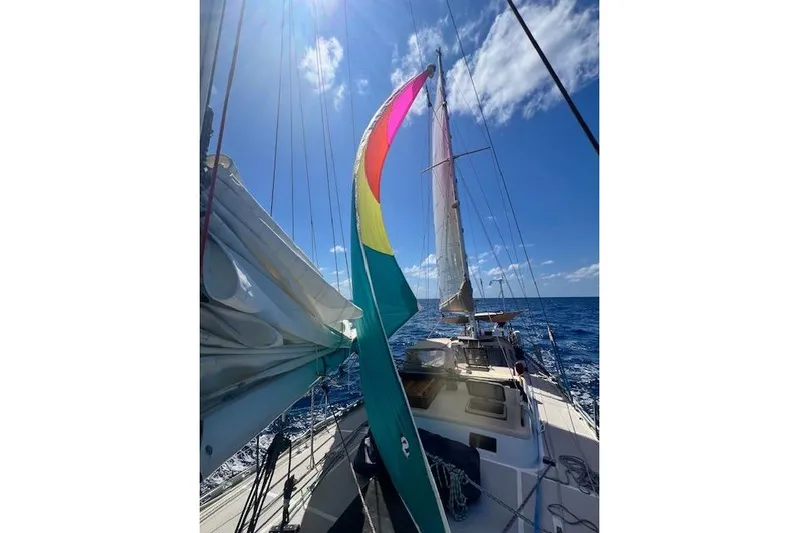  Yacht Photos Pics Sailing on a 1985 Robert Clark Ketch under clear blue skies.