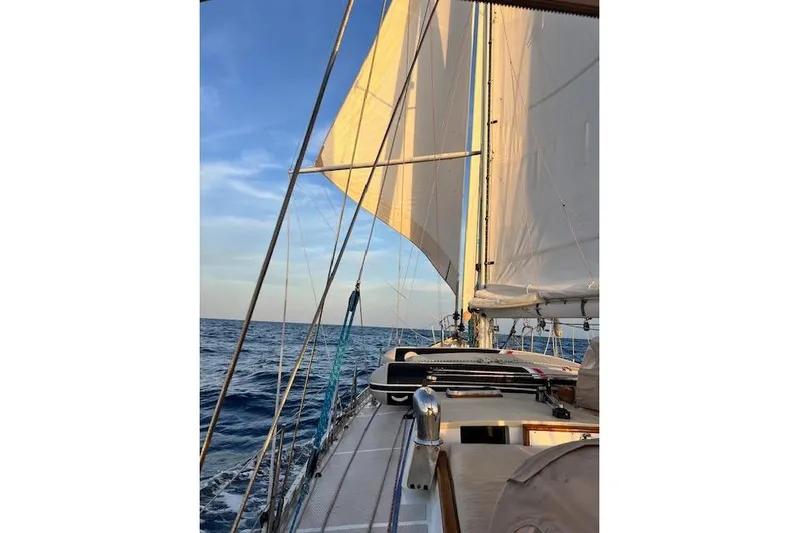  Yacht Photos Pics Sailing on a 1985 Robert Clark Ketch under clear blue skies.