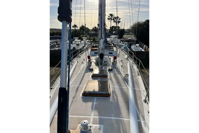  Yacht Photos Pics 1985 Robert Clark Ketch sailboat deck view with masts and rigging under a sunny sky.