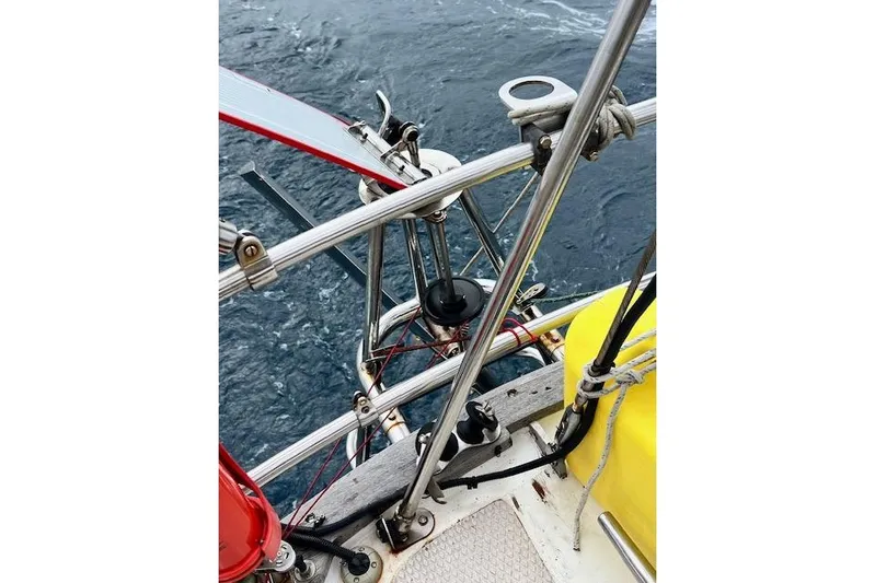  Yacht Photos Pics Close-up of 1985 Robert Clark Ketch sailboat deck with rigging and ocean view.