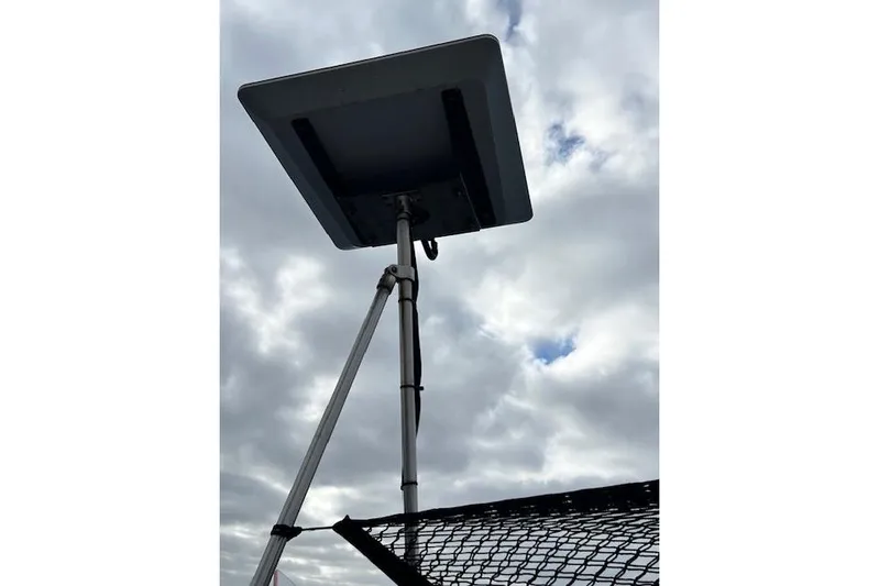 Yacht Photos Pics Satellite dish on Robert Clark Ketch, 1985, against cloudy sky.