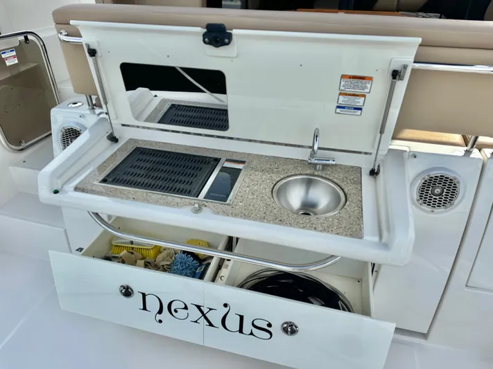  Yacht Photos Pics Kitchen area on 2016 Sea Ray 400 Sundancer with sink and storage.