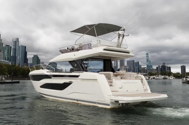  Yacht Photos Pics Luxury Prestige F4.9 yacht cruising near city skyline, 2026 model.