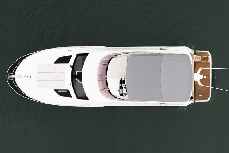  Yacht Photos Pics Aerial view of 2026 Prestige F4.9 yacht on water, showcasing sleek design and spacious deck.