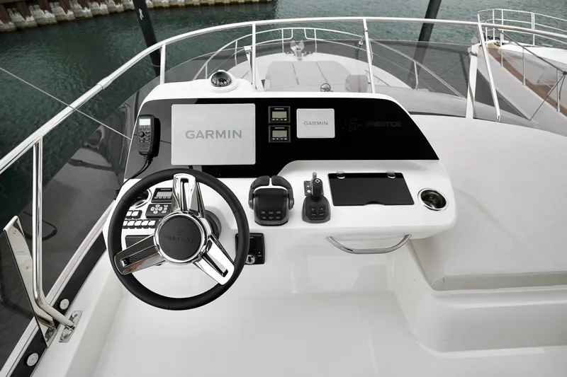  Yacht Photos Pics Cockpit of 2026 Prestige F4.9 yacht with Garmin navigation system and modern controls.