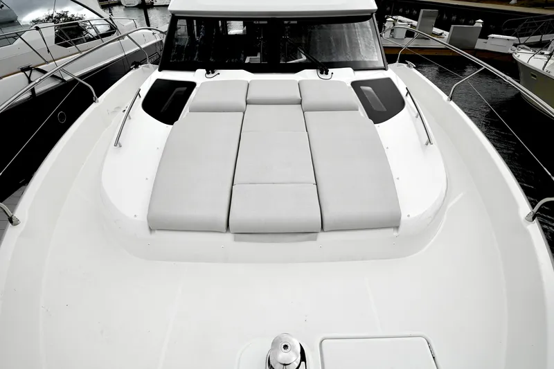  Yacht Photos Pics Prestige F4.9 yacht 2026 model with spacious sunbathing deck, docked at marina.