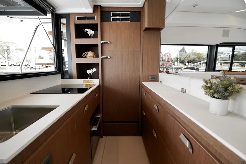  Yacht Photos Pics Modern yacht kitchen interior with wood cabinetry, Prestige F4.9, 2026 model.