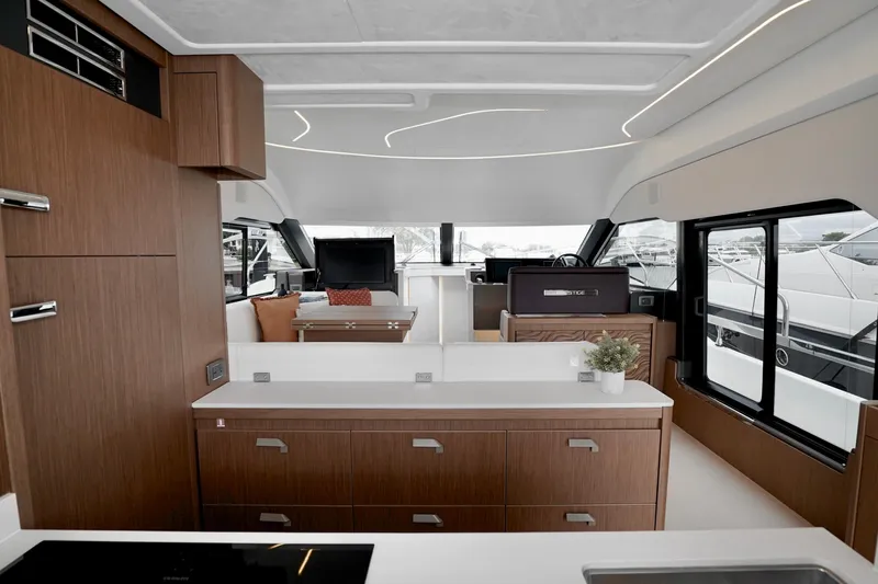  Yacht Photos Pics Luxurious interior of 2026 Prestige F4.9 yacht with modern wood finishes and sleek design.