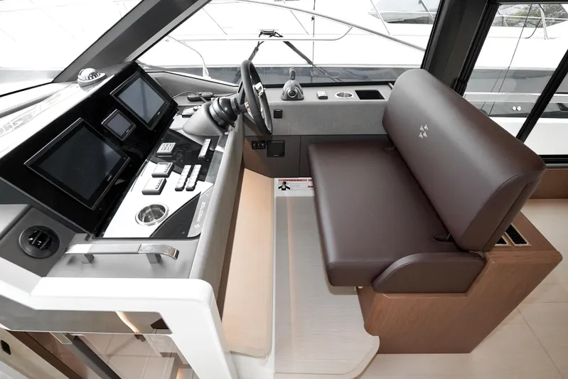  Yacht Photos Pics Luxury yacht helm with modern controls and leather seating, Prestige F4.9, 2026 model.