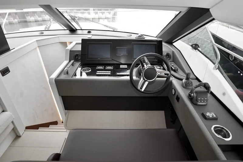  Yacht Photos Pics Modern helm of 2026 Prestige F4.9 yacht with advanced navigation controls and sleek design.
