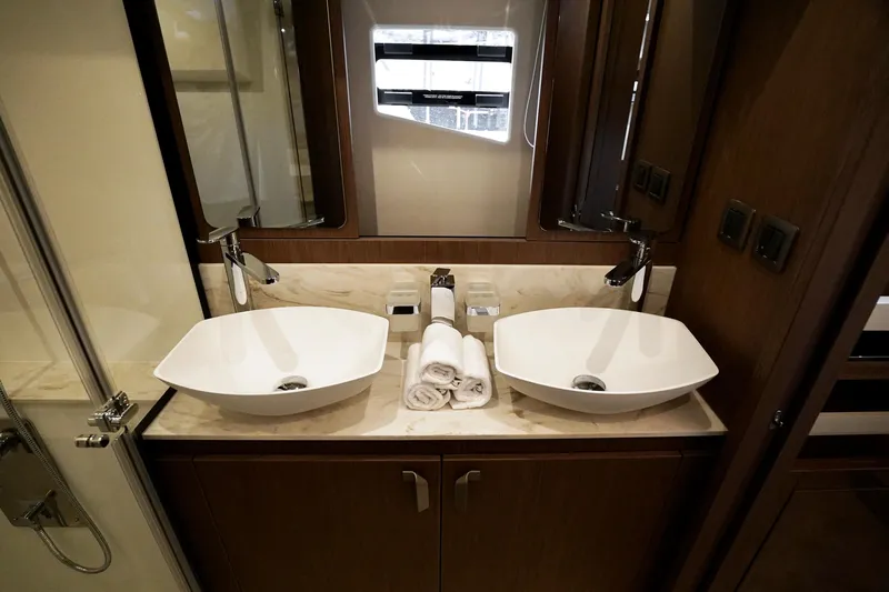  Yacht Photos Pics Luxurious bathroom with dual sinks in 2026 Prestige F4.9 model yacht.