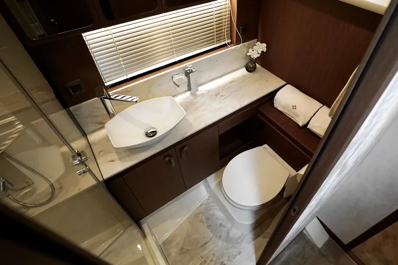  Yacht Photos Pics Luxurious bathroom in 2026 Prestige F4.9 yacht with modern fixtures and elegant design.