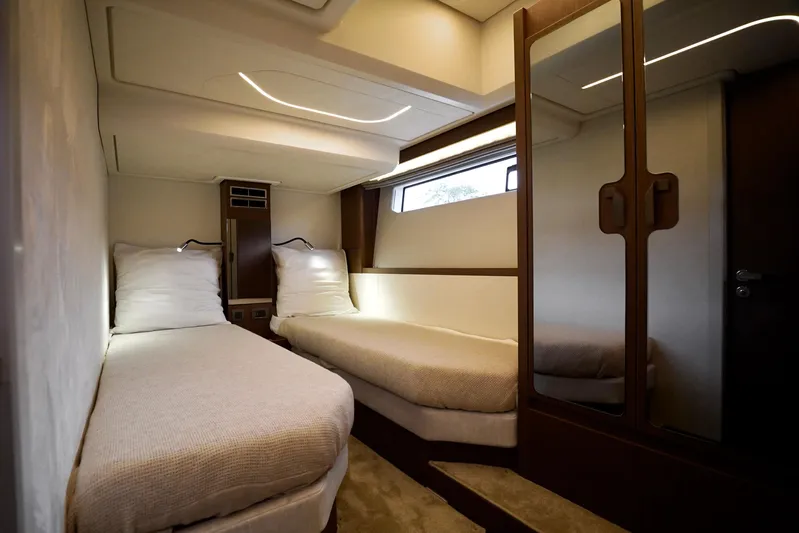  Yacht Photos Pics Luxurious twin cabin interior of 2026 Prestige F4.9 yacht, featuring modern design and ambient lighting.