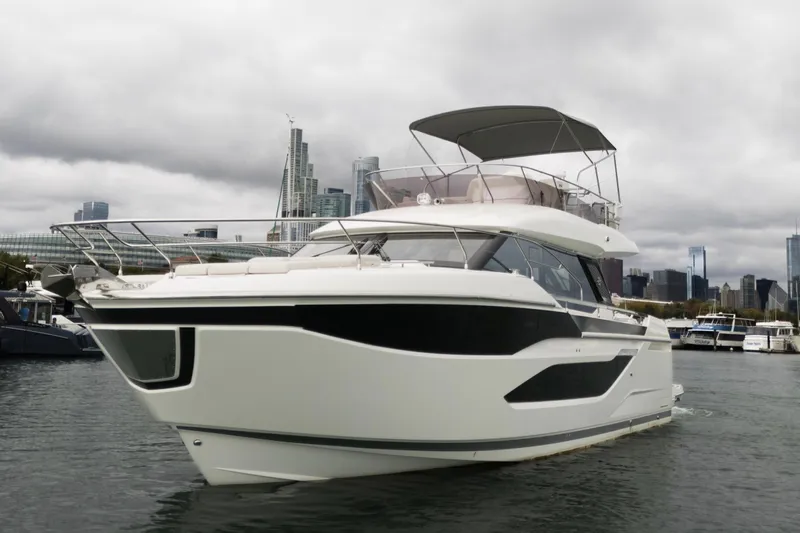  Yacht Photos Pics Luxury 2026 Prestige F4.9 yacht docked in urban marina, overcast sky.
