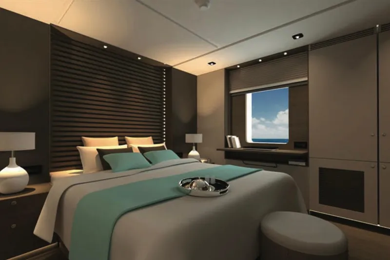 Nirvana Yacht Photos Pics Luxurious modern bedroom with ocean view, featuring elegant decor and ambient lighting, 2027 design.