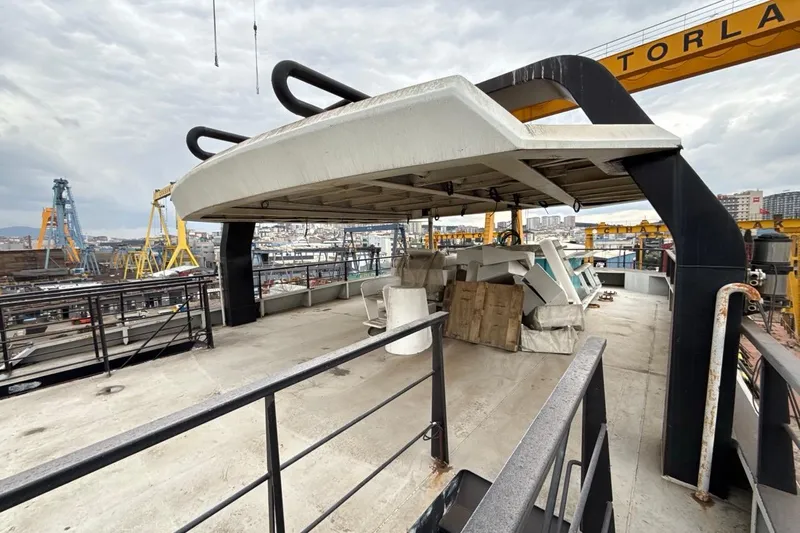 Nirvana Yacht Photos Pics Rooftop view of Soyaslan Custom 2027 boat under construction at a shipyard.