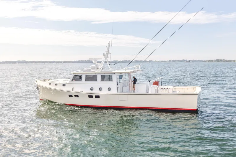 Stella Rose Yacht Photos Pics 2021 Mussel Ridge Downeast boat cruising on calm waters under a clear sky.