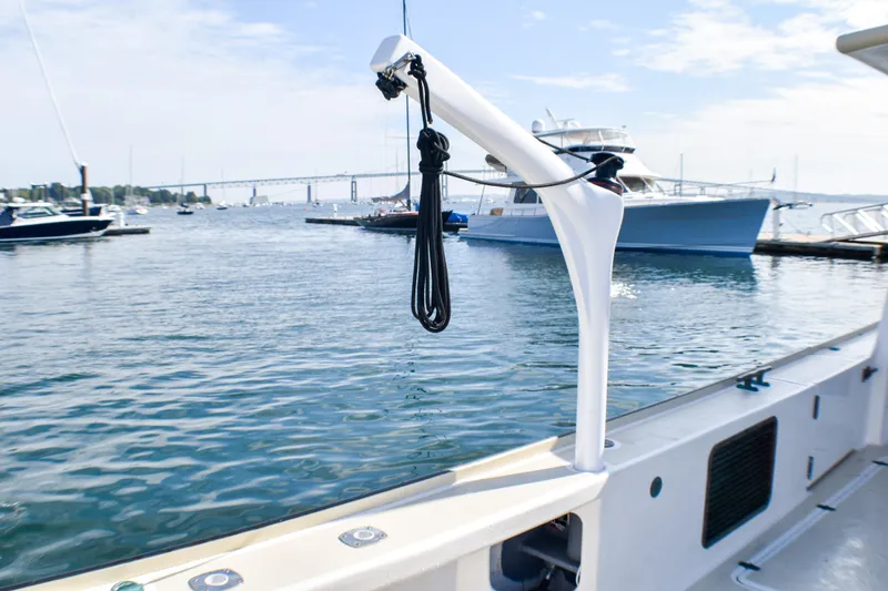 Stella Rose Yacht Photos Pics 2021 Mussel Ridge Downeast boat docked in a marina with scenic water view.