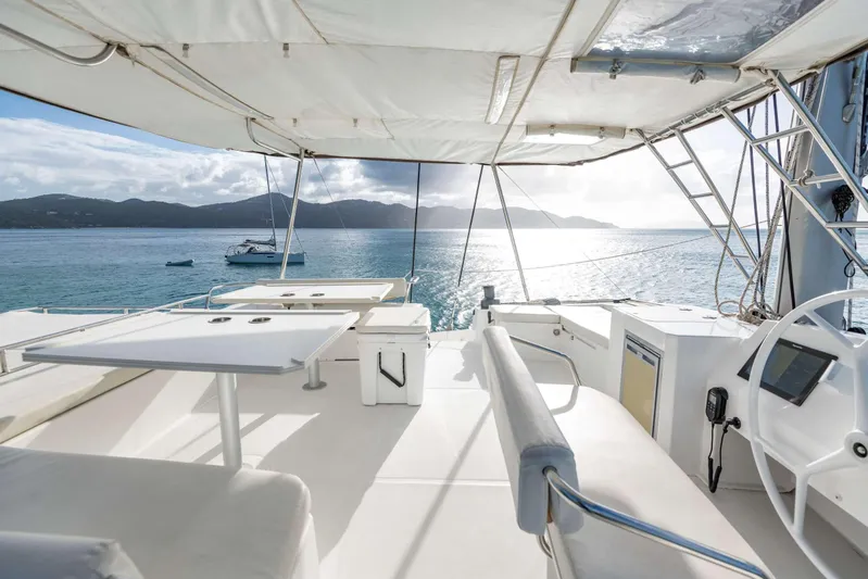 Ad Astra Yacht Photos Pics Spacious deck of 2020 Bali 5.4 catamaran with ocean view and seating area.