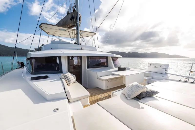 Ad Astra Yacht Photos Pics Luxurious 2020 Bali 5.4 catamaran with spacious deck, scenic ocean view, and comfortable seating.