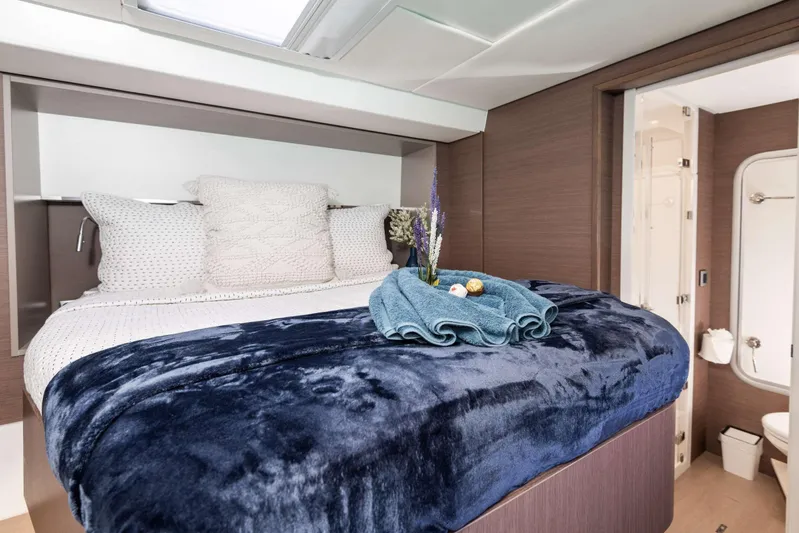 Ad Astra Yacht Photos Pics Luxurious bedroom in 2020 Bali 5.4 yacht with plush bedding and modern decor.