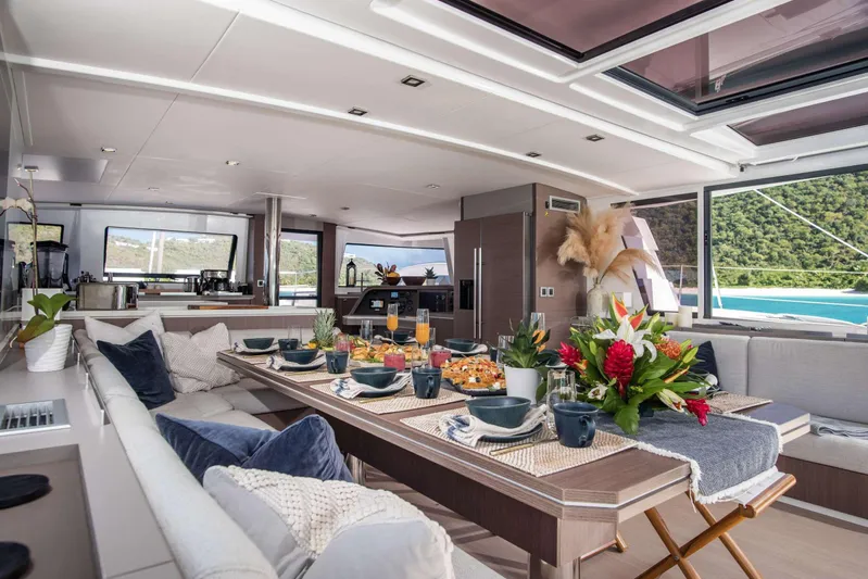 Ad Astra Yacht Photos Pics Luxurious Bali 5.4 yacht interior with elegant dining setup, 2020 model.