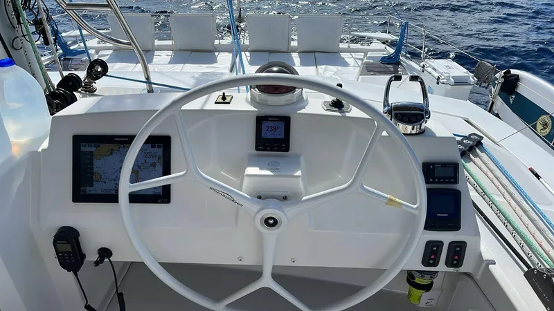 Ad Astra Yacht Photos Pics Steering wheel of a 2020 Bali 5.4 yacht with navigation instruments.