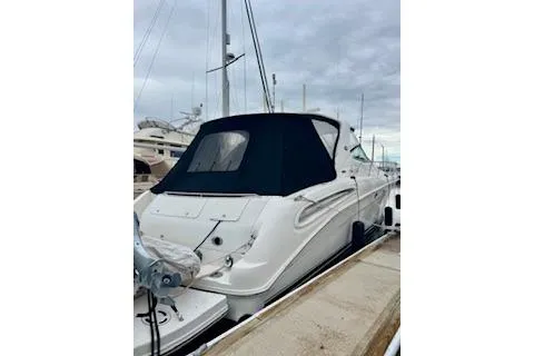 Play It Again Yacht Photos Pics 2001 Sea Ray Sundancer 540 yacht docked at marina under cloudy sky.