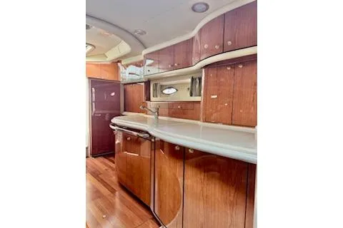 Play It Again Yacht Photos Pics 2001 Sea Ray Sundancer 540 yacht interior with wooden cabinetry and sleek countertops.