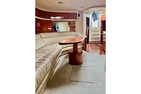 Play It Again Yacht Photos Pics Luxurious interior of 2001 Sea Ray Sundancer 540 yacht with plush seating and elegant wood finishes.