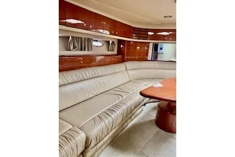 Play It Again Yacht Photos Pics Luxurious interior of 2001 Sea Ray Sundancer 540 yacht with leather seating and wooden accents.