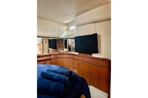 Play It Again Yacht Photos Pics Luxurious interior of 2001 Sea Ray Sundancer 540 yacht with elegant wood cabinetry.