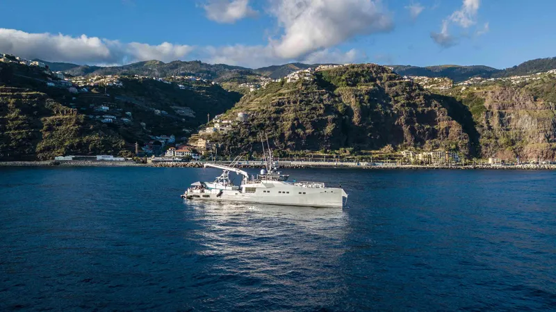 Bad Company Support Yacht Photos Pics Damen YS 4508 yacht cruising near scenic coastline, 2019.