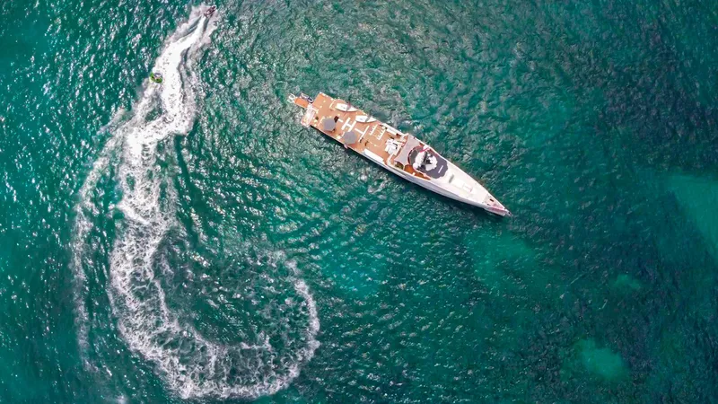 Bad Company Support Yacht Photos Pics Aerial view of Damen YS 4508 yacht on turquoise water, 2019.